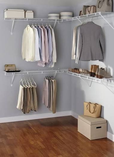 White wire closet shelving with two levels of hanging storage and shoe shelves